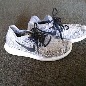 gray/silver  & black Nike RBX shoes